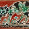 a cat with green and black spots
