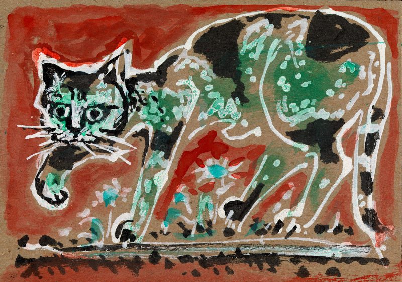 a cat with green and black spots